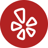Red circle with a white stylized flower logo consisting of five petals.